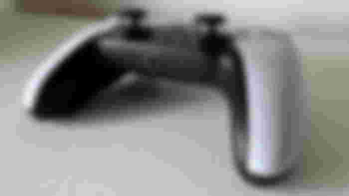 Bottom of a black and white controller.