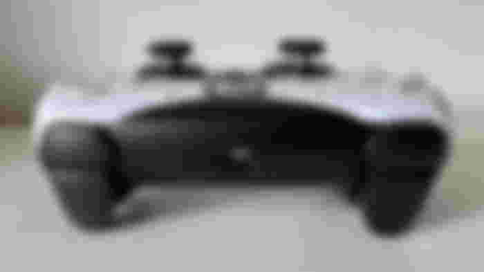Top triggers of a black and white controller.