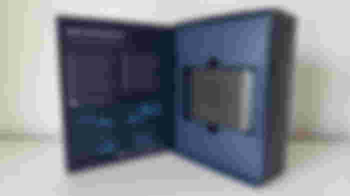 A black Elgato capture card inside a blue box.